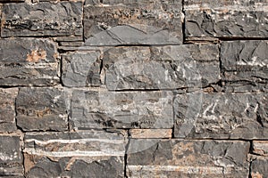 Texture of a stone. Old stone wall texture background. Grey stone wall as a background or texture. Stone wall of natural stones in