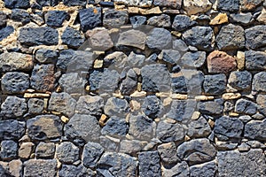 Texture of a stone wall in the ancient monastery of Sevanavank. Armenia