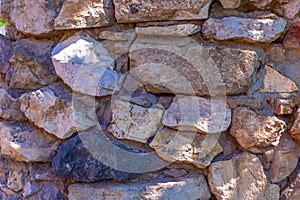 The texture of the stone wall