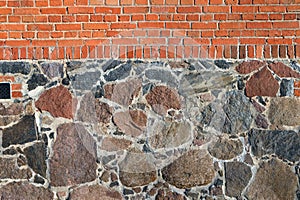 Dark red bricks and stones wall