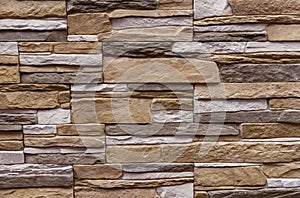 Texture of the stone wall. Panel of stones for finishing the facade of the building and interior design of the house. Background