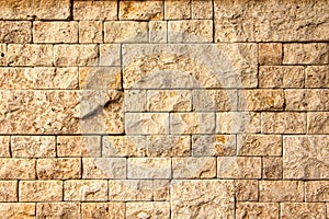 Texture of stone wall, square yellow travertine tile