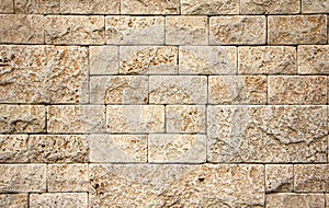 Texture of stone wall, square yellow travertine tile