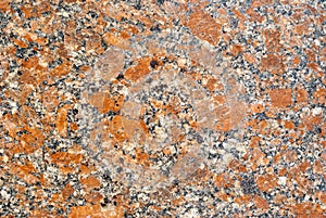 Texture - the surface of a granite slab with orange impregnations