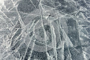 The texture of the surface of ice on a frozen lake. Natural background