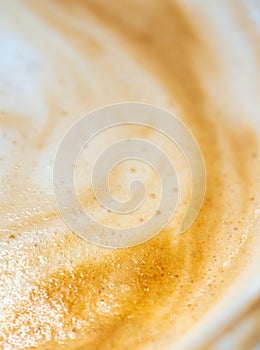 Texture surface of soft and delicate milk froth in a cup of coffee