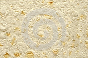 The texture of a thin freshly baked homemade oriental lavash, top view. Armenian lavash, textured bread background