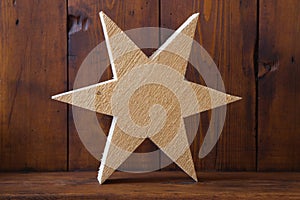 Texture of untreated wooden handmade star for christmas