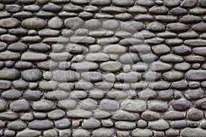 Texture of the wall made from pebble