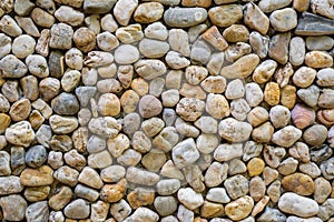 Texture of a wall made of sea stones