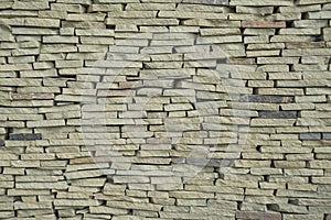 The texture of a wall made of stone slate