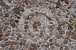 Texture of wall with multicolored gravel pebbledash