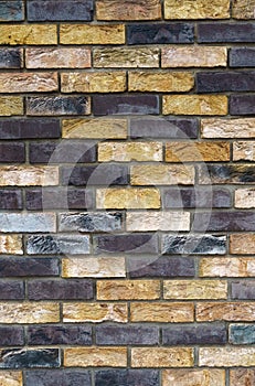 The texture of the wall from the new gray-yellow bricks.