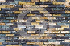 The texture of the wall from the new gray-yellow bricks.