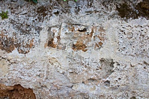 Texture of a wall of old tuff bricks