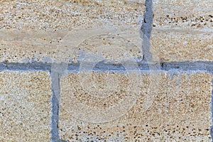 The texture of the wall of stone bricks