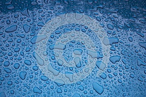 Texture - water drops on a blue body of the car