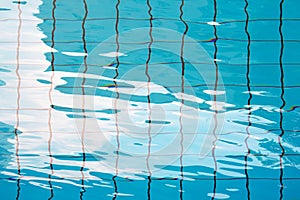 Texture of the water in the pool. Empty indoors Children`s swimming pool, public swimming pool in fitess club. Children`s swimmi