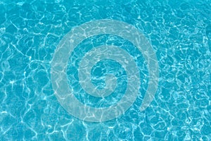 Texture of water surface. Overhead view, Swimming pool bottom caustics ripple and flow with waves background