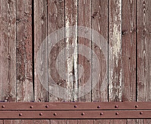 The texture of weathered wooden wall. Aged wooden plank fence of vertical flat board