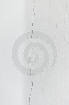 Texture white concrete wall has cracks
