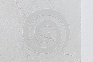 Texture white concrete wall has cracks