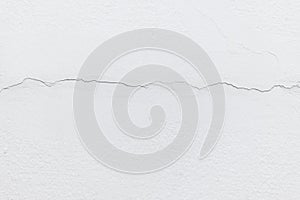 Texture white concrete wall has cracks