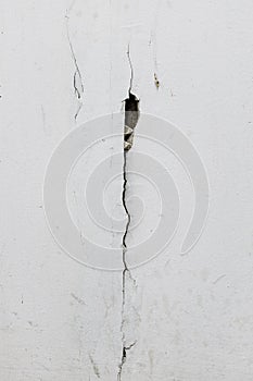 Texture white concrete wall has cracks