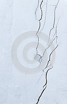 Texture white concrete wall has cracks