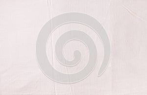 Texture of white cotton fabric with creases