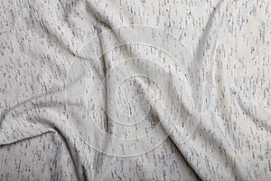 Texture of white cotton wrinkled fabric with dark threads inclusion, background or backdrop. Clothing, sewing, gressmaking