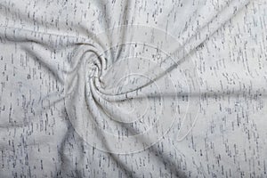 Texture of white cotton wrinkled fabric with dark threads inclusion, background or backdrop. Clothing, sewing, gressmaking
