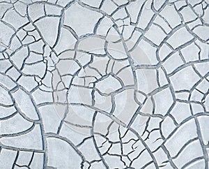White cracked clay on dried river bed, natural pattern