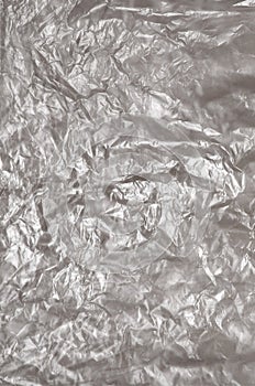 Texture of white crumpled cellophane surface transparent on sunlight. Concept of materials for packaging, product protection
