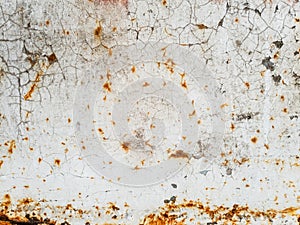 Texture of white paint with cracks and rust on metal surface, background