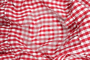Texture of white-red crumpled fabric in a cage