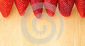 Summer.Strawberry close up view from above on wooden background tray photo