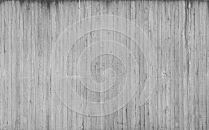 Texture of wooden formwork stamped on a raw concrete wall photo