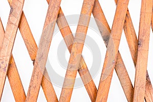 Texture of the wooden lattice isolated on white background. Natural wooden diagonal lattice