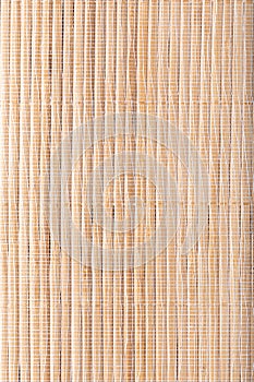 Texture of wooden mat. Asian style straw weave rug. Background bamboo sticks with thread uniting