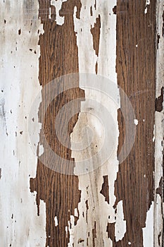 Texture of a wooden surface with white cracked paint