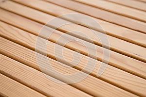 Texture of a wooden table, yellow tint