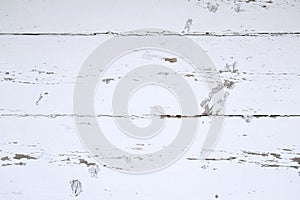 Texture - a wooden, white wall with scrapes.