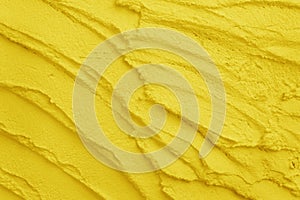 Texture of yellow color cement or plaster for background and design art work, grunge concrete wall pattern