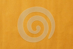 The texture of a yellow-gold disposable textile towel