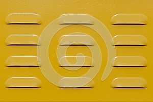 Texture - yellow metal plate with ventilation holes