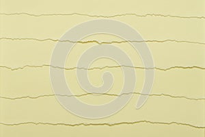 Texture of yellow paper with torn edges as background