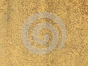 Texture of the yellow plaster bark beetle on the wall. Seamless texture