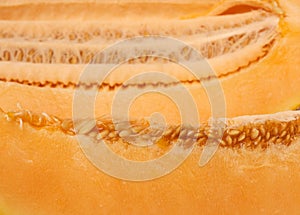 Texture of yellow ripe melon flesh with seeds