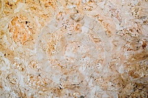 Texture of yellow sharp carved natural crumbly friable sandy natural stone and copy the place